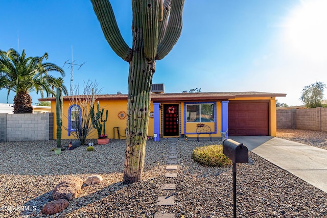 ranch-style house featuring a garage