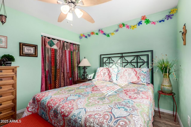 bedroom featuring ceiling fan and wood-type flooring