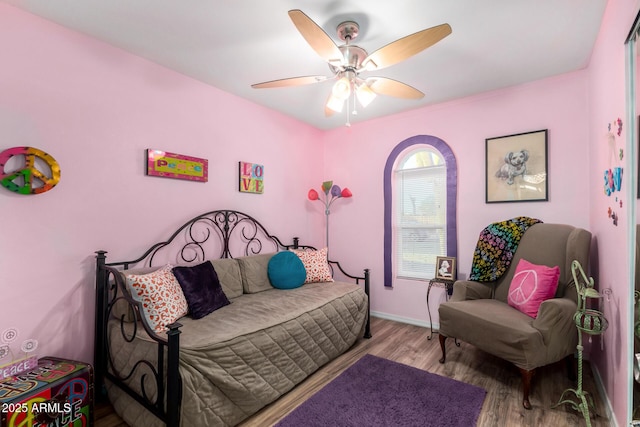 bedroom with ceiling fan and light hardwood / wood-style floors