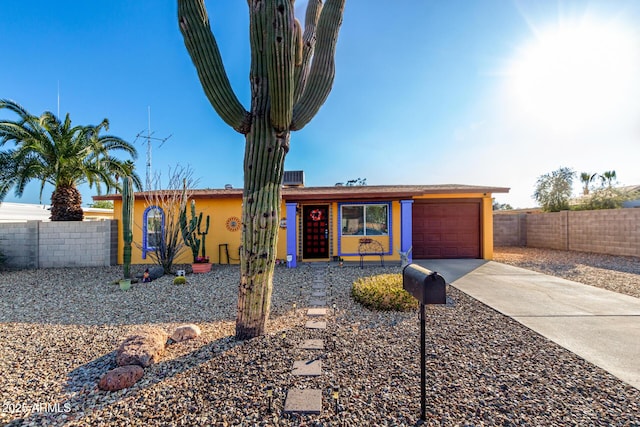 ranch-style home featuring a garage