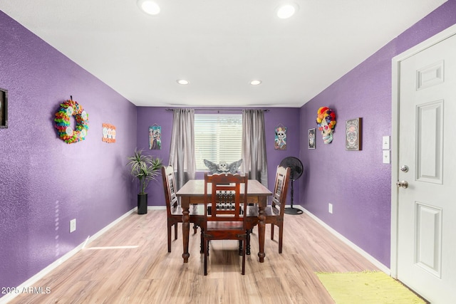 dining space with light hardwood / wood-style floors