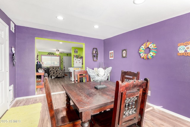 dining area featuring ceiling fan and hardwood / wood-style floors