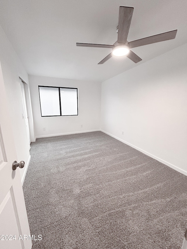 unfurnished room featuring carpet flooring and ceiling fan