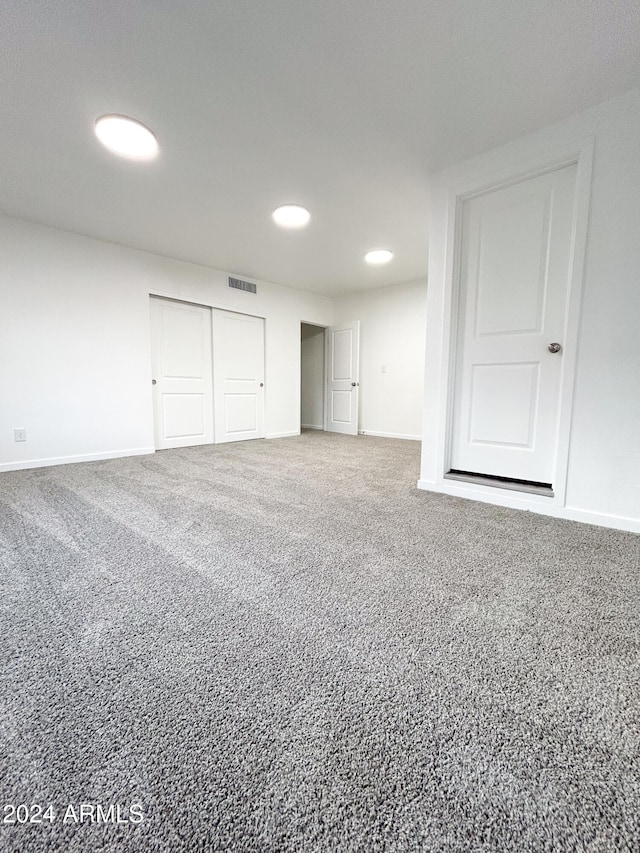 unfurnished bedroom with carpet floors and a closet