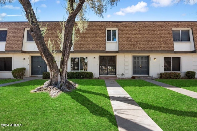 view of property with a front lawn