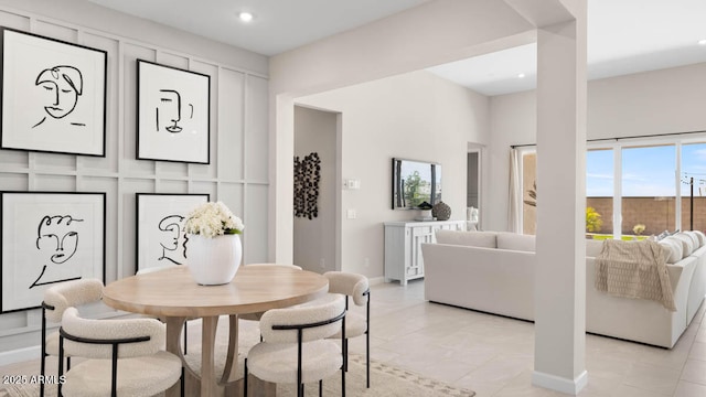 dining room with recessed lighting and baseboards