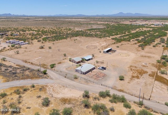 birds eye view of property with a mountain view