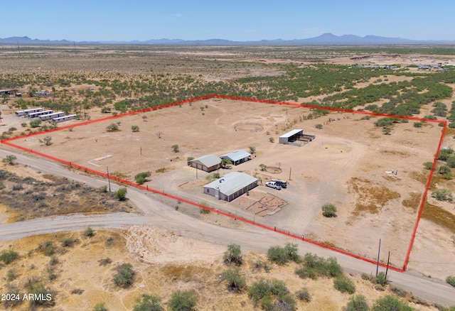 birds eye view of property featuring a mountain view