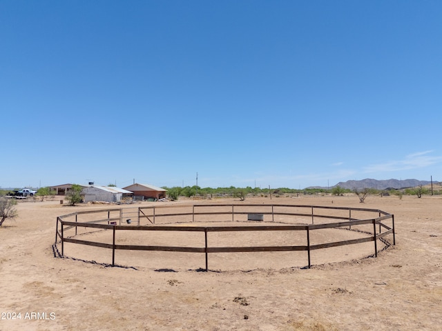 view of yard with a mountain view and a rural view