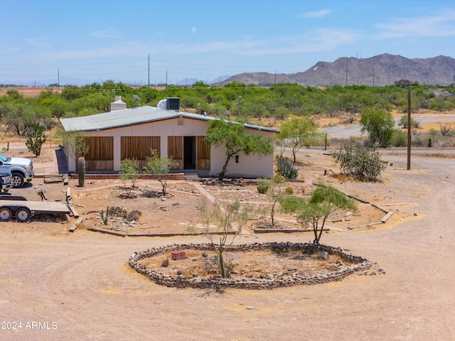 view of front of home featuring a mountain view and cooling unit