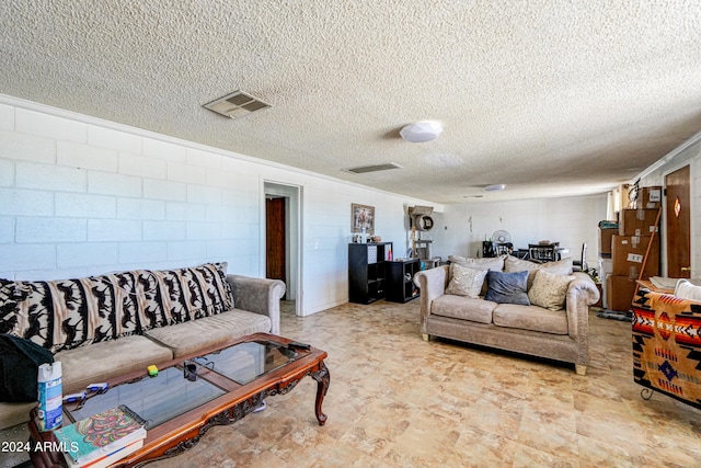 living room with a textured ceiling