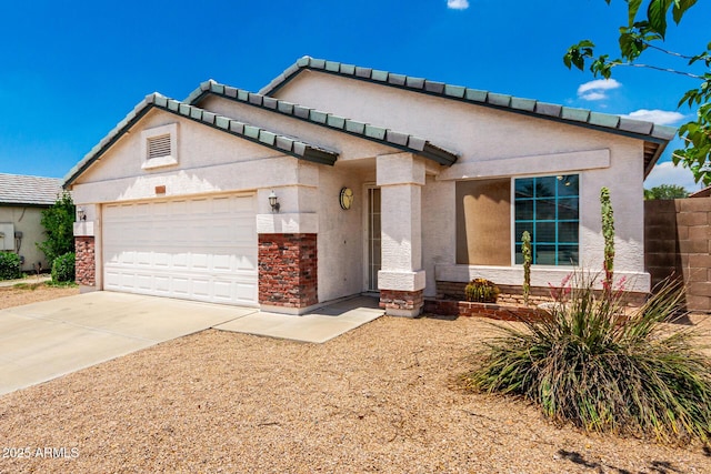 3006 W Matthew Dr, Phoenix, AZ 85027 - view of front of property featuring a garage, driveway, stucco siding, and stone siding
