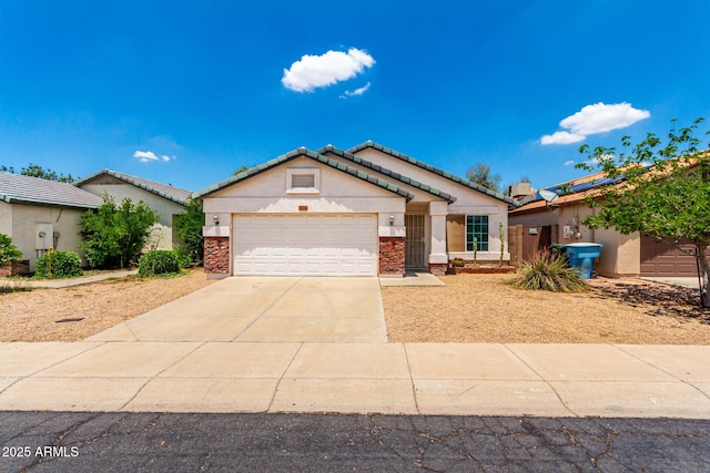 3006 W Matthew Dr, Phoenix, AZ 85027 - view of front of home featuring concrete driveway, an attached garage, stucco siding, and a tiled roof