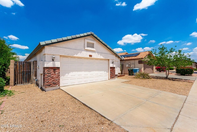 3006 W Matthew Dr, Phoenix, AZ 85027 - view of front facade featuring stucco siding, driveway, solar panels, and a gate
