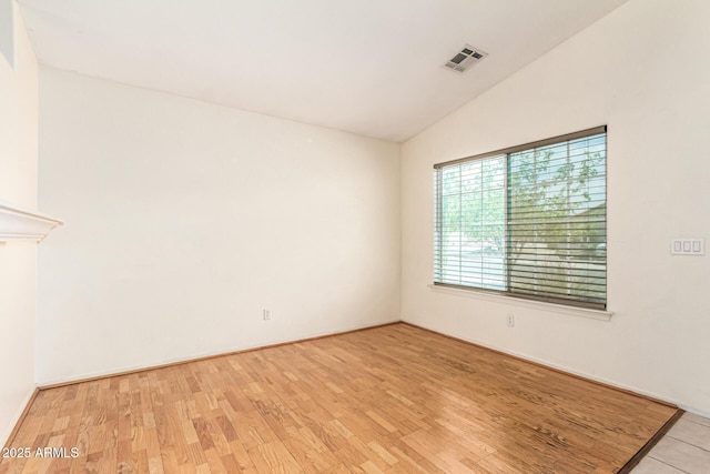 3006 W Matthew Dr, Phoenix, AZ 85027 - unfurnished room with vaulted ceiling and wood finished floors