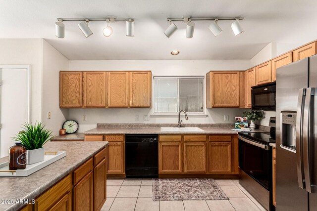 3006 W Matthew Dr, Phoenix, AZ 85027 - kitchen with black appliances, a sink, rail lighting, and light tile patterned floors