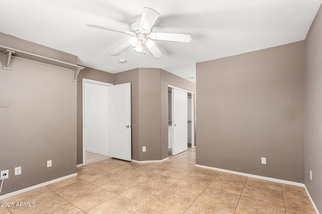 3006 W Matthew Dr, Phoenix, AZ 85027 - unfurnished bedroom featuring baseboards, a ceiling fan, light tile patterned floors, and a closet