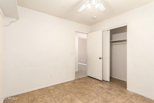 3006 W Matthew Dr, Phoenix, AZ 85027 - unfurnished bedroom with baseboards, light tile patterned flooring, a ceiling fan, and a closet