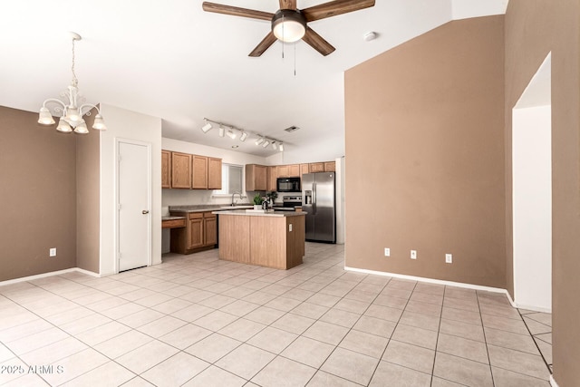 3006 W Matthew Dr, Phoenix, AZ 85027 - kitchen featuring appliances with stainless steel finishes, a sink, a ceiling fan, a chandelier, and a kitchen island