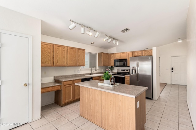 3006 W Matthew Dr, Phoenix, AZ 85027 - kitchen featuring stainless steel appliances, light tile patterned floors, a sink, and a kitchen island