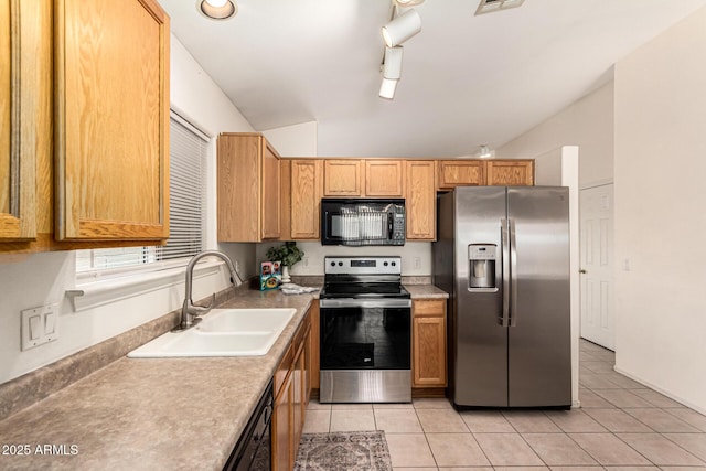 3006 W Matthew Dr, Phoenix, AZ 85027 - kitchen with appliances with stainless steel finishes, a sink, lofted ceiling, light tile patterned flooring, and light countertops