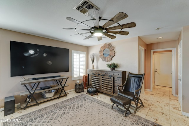 sitting room with ceiling fan