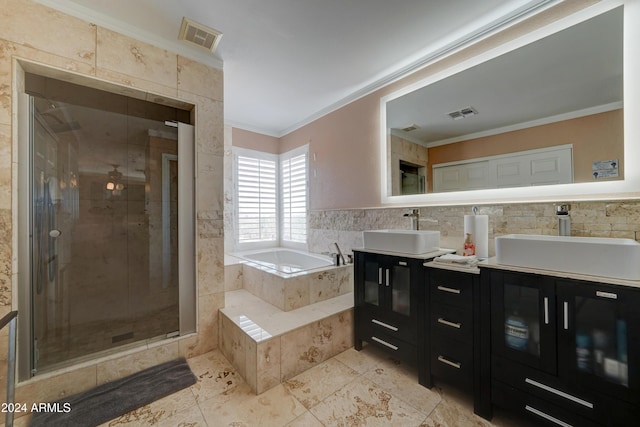 bathroom with separate shower and tub, crown molding, vanity, and tile walls