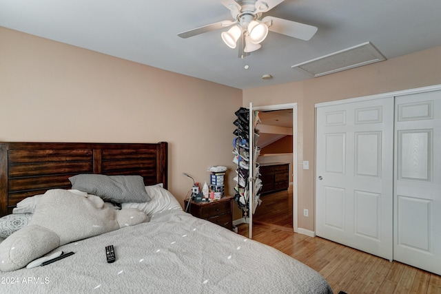 bedroom featuring a closet, hardwood / wood-style floors, and ceiling fan