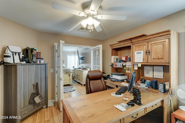 office space with light hardwood / wood-style flooring and ceiling fan