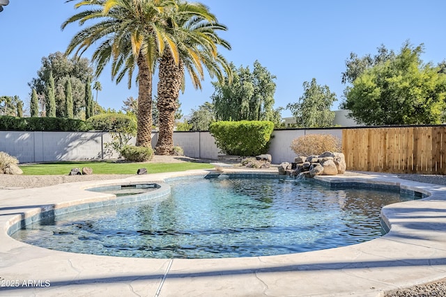 view of swimming pool with a fenced backyard