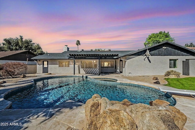 pool at dusk featuring a patio, an in ground hot tub, a diving board, an outdoor pool, and a pergola