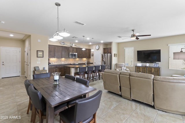 dining room featuring plenty of natural light, recessed lighting, visible vents, and ceiling fan