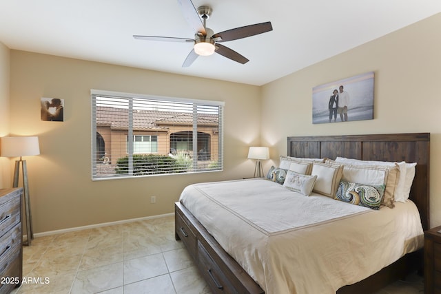 bedroom featuring a ceiling fan and baseboards