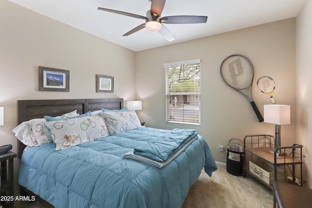 bedroom featuring baseboards and a ceiling fan