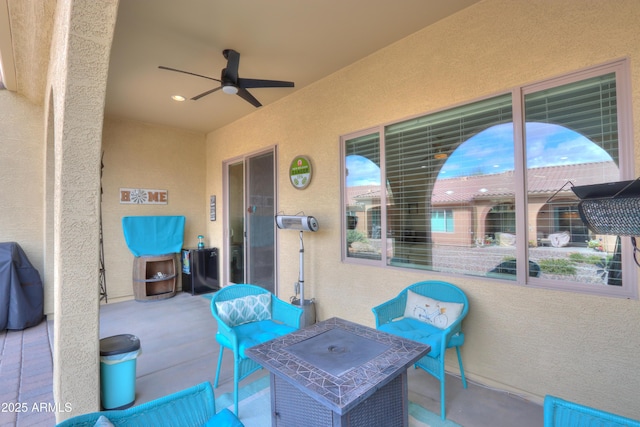 view of patio featuring a ceiling fan