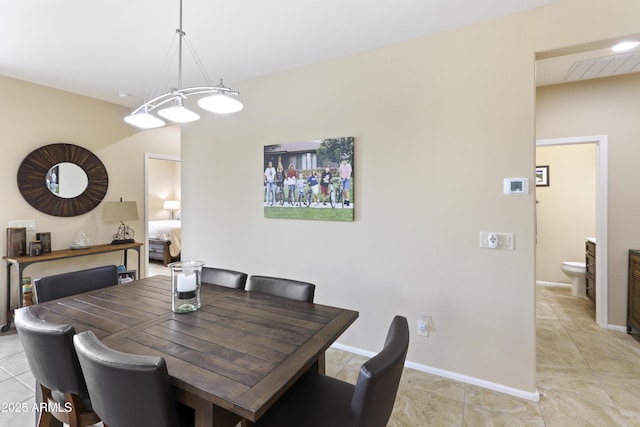 dining space with light tile patterned flooring, visible vents, and baseboards