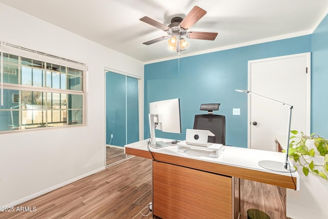 home office with ceiling fan, baseboards, and wood finished floors