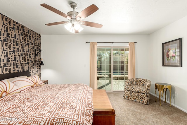 carpeted bedroom featuring baseboards, a ceiling fan, and access to exterior