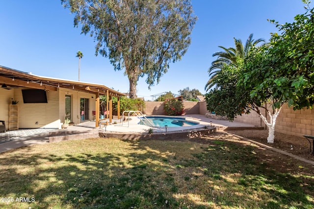 view of yard featuring a patio area, a fenced backyard, and a fenced in pool