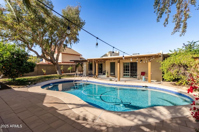 view of pool featuring a patio area, fence, and a fenced in pool