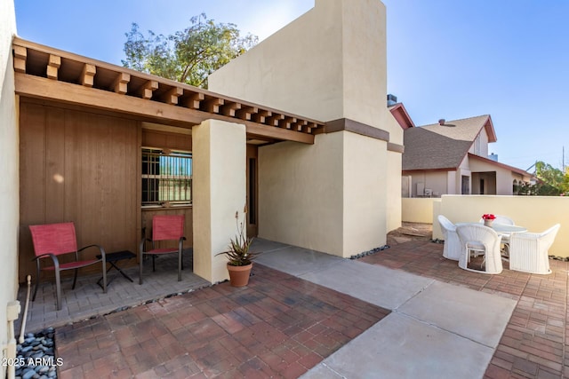 view of patio / terrace with outdoor dining space and fence