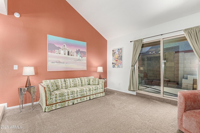 living area featuring vaulted ceiling, carpet, and baseboards