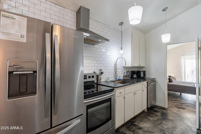 kitchen featuring white cabinets, wall chimney range hood, sink, decorative light fixtures, and stainless steel appliances