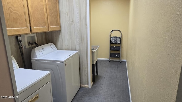 washroom with cabinets and independent washer and dryer