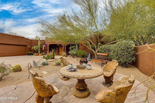 view of patio / terrace with an outdoor fire pit