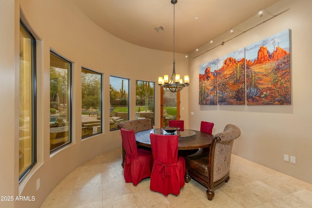 dining area with a notable chandelier