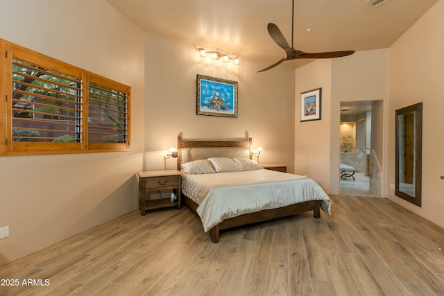 bedroom with ceiling fan and wood-type flooring