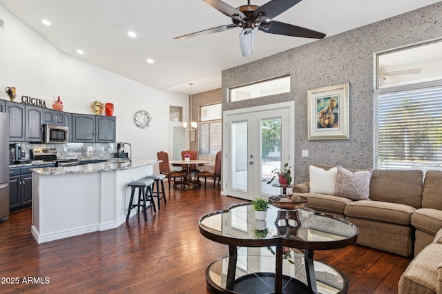 living area featuring ceiling fan, recessed lighting, dark wood-style flooring, french doors, and wallpapered walls