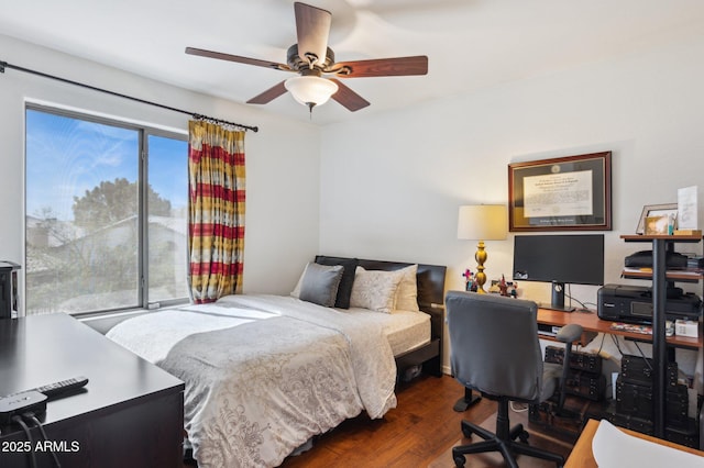 bedroom with a ceiling fan and wood finished floors