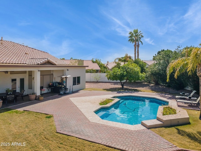 view of swimming pool with a fenced in pool, french doors, a yard, a patio area, and a fenced backyard